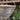 Woven hanging basket with a blurred garden background