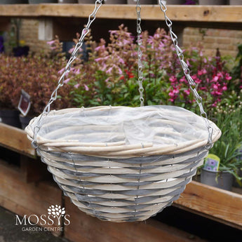 Wicker hanging basket with a chain against a garden background, featuring Mossy's Garden Centre branding.